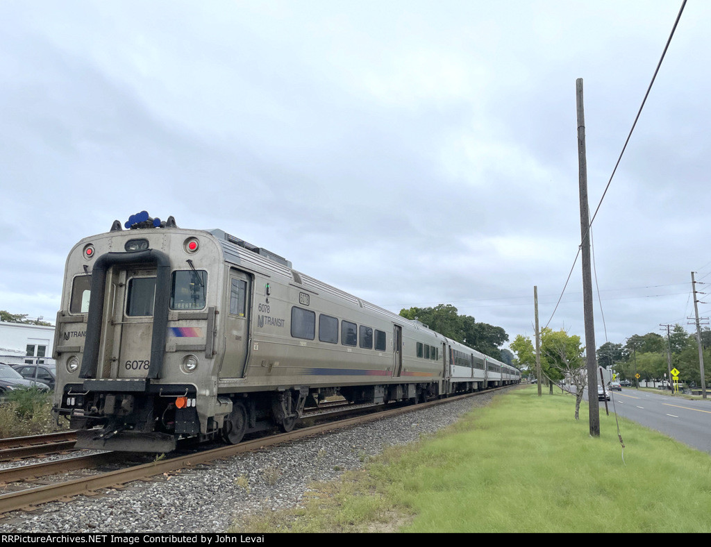 Comet V Cab Car # 6078 brings up the rear of NJ Transit Train # 4351 after it departs Bradley Beach Station toward its next stop of Belmar.